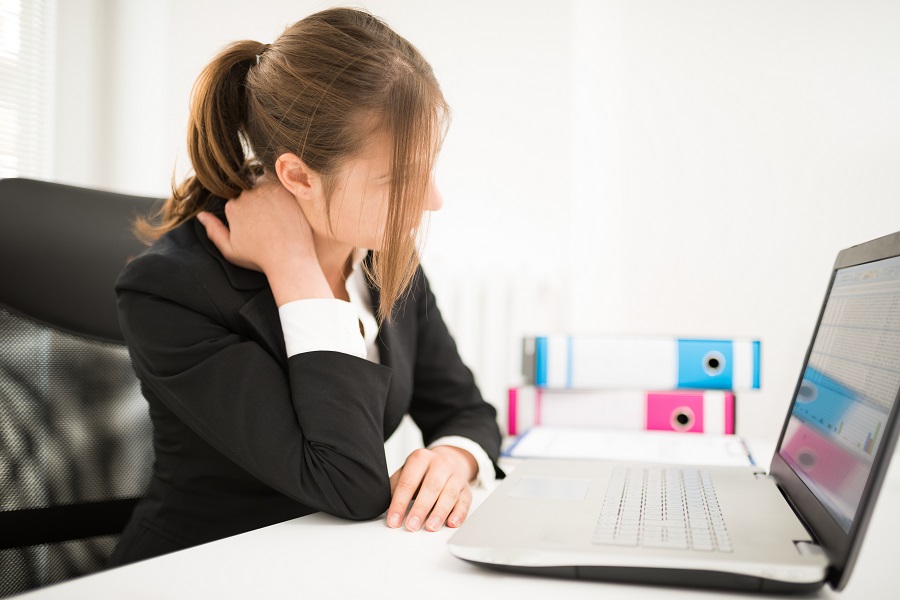 Woman suffering neck pain due to bad posture